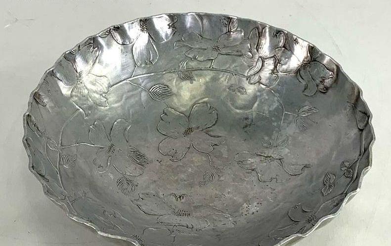 Hammered aluminum serving bowl with raised dogwood blossoms and scalloped rim, view 2