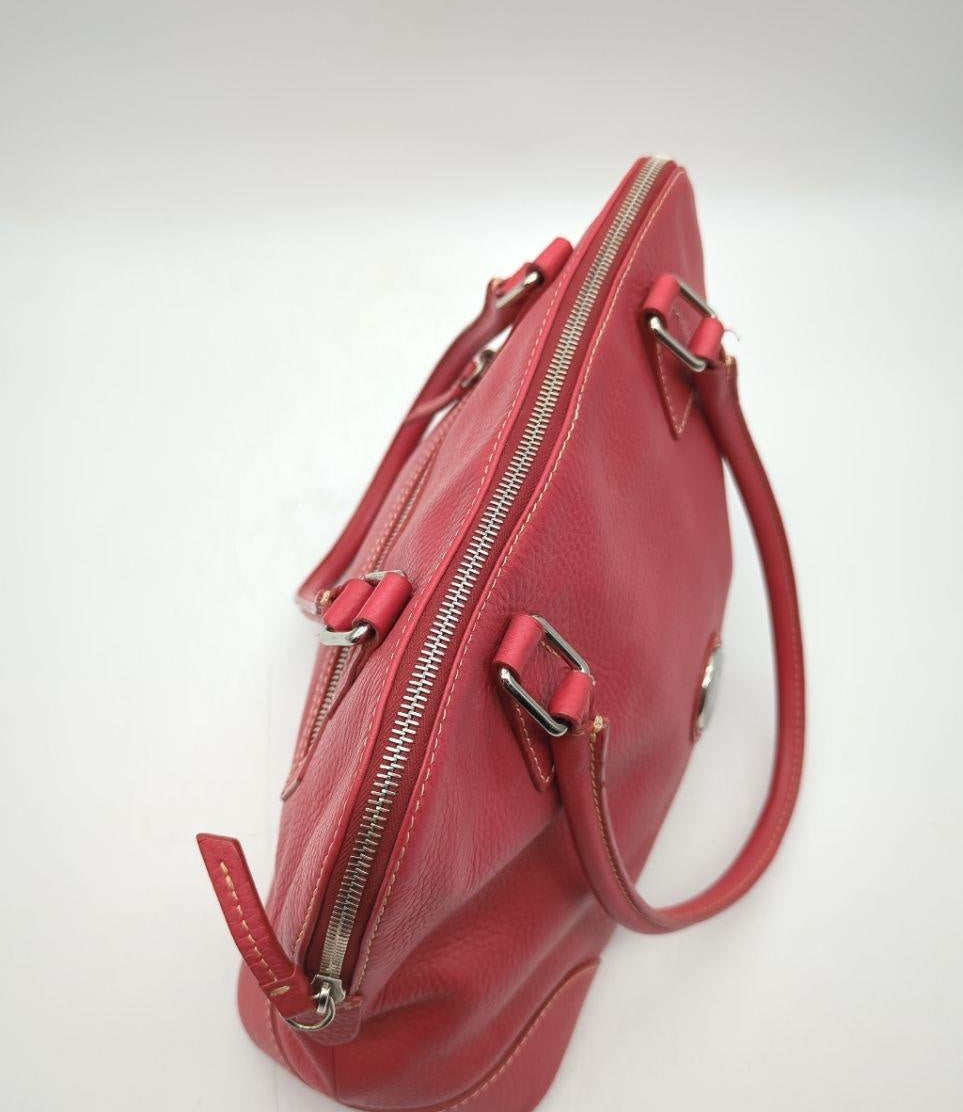 Dooney and Bourke red pebbled leather domed satchel with cream contrast stitching and rolled handles, view 7