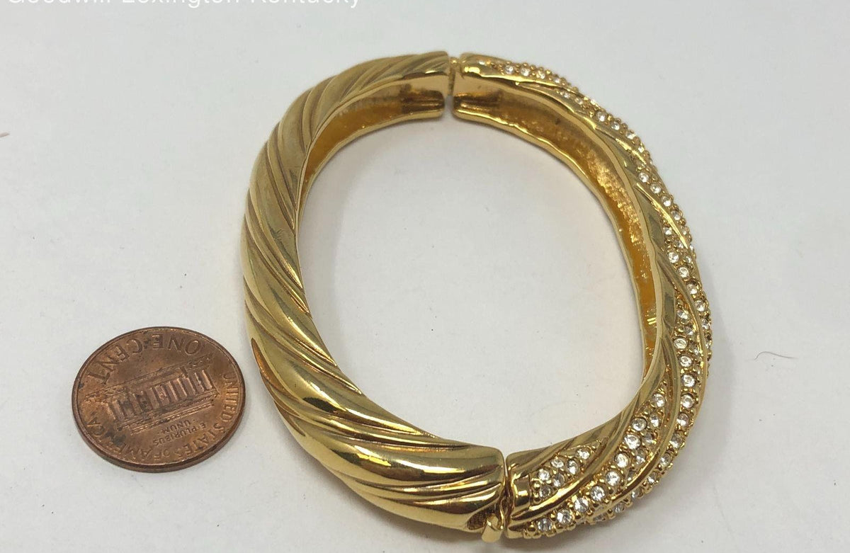 Signed Swarovski gold-tone hinged crossover bangle with rows of clear crystals, view 3
