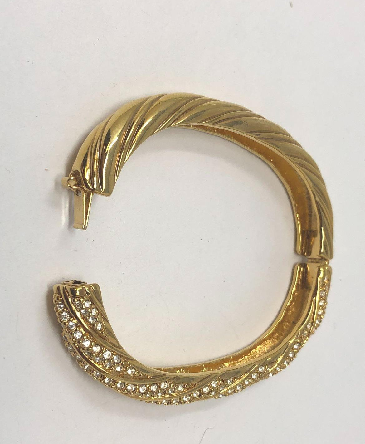 Signed Swarovski gold-tone hinged crossover bangle with rows of clear crystals, view 5