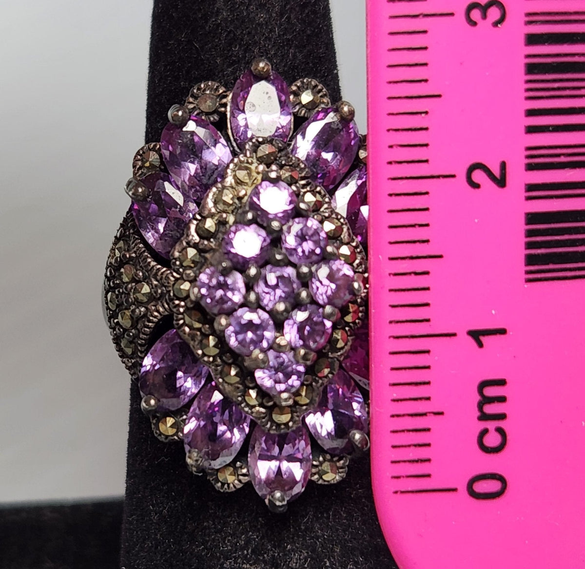 Sterling silver cocktail ring stamped 925 with purple stones and marcasite accents, view 10