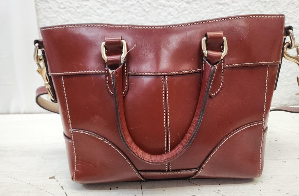 Dooney & Bourke reddish brown smooth leather satchel with rolled handles and crossbody strap, view 5