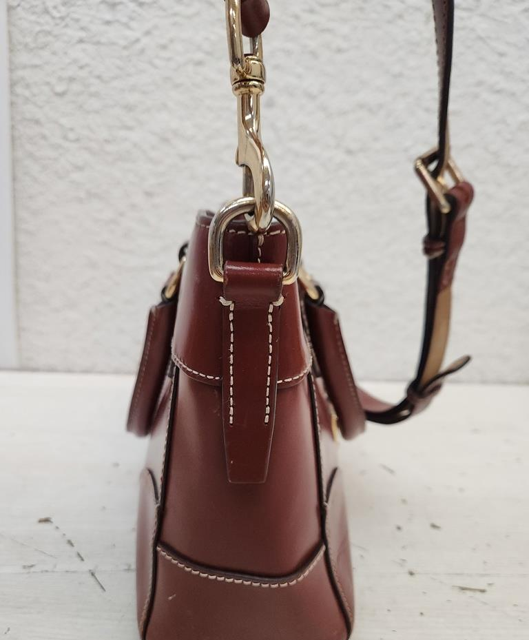 Dooney & Bourke reddish brown smooth leather satchel with rolled handles and crossbody strap, view 6
