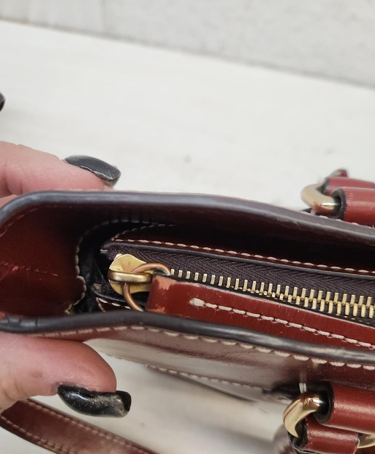 Dooney & Bourke reddish brown smooth leather satchel with rolled handles and crossbody strap, view 7