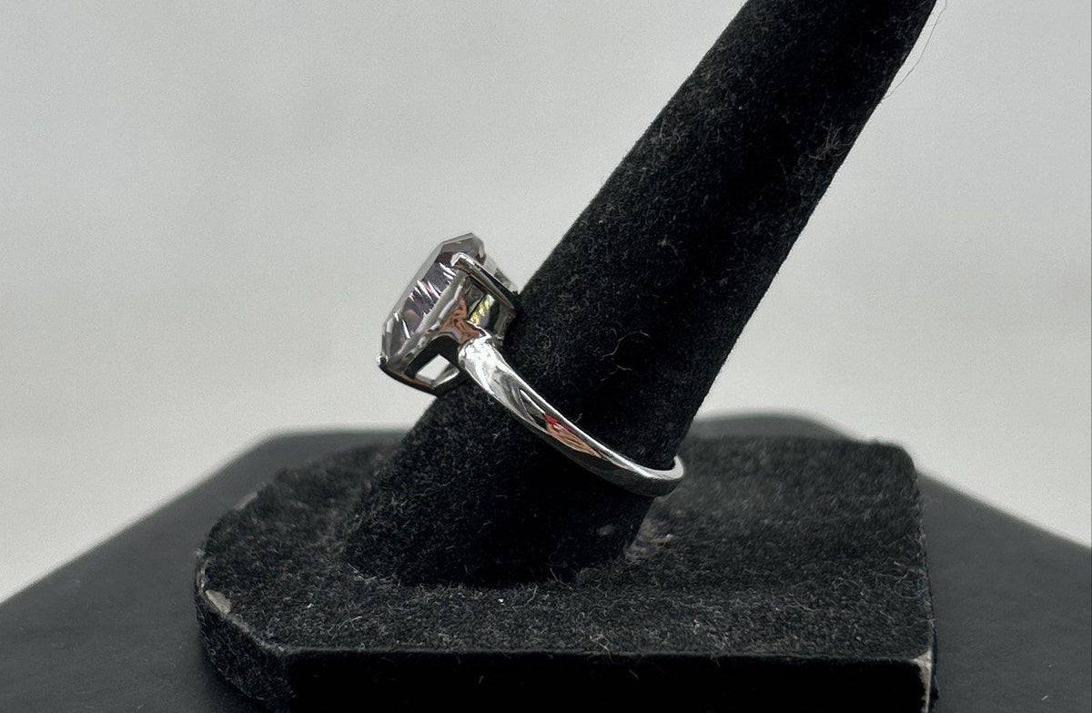 Silver cocktail ring with pear-shaped iridescent stone in prong setting, view 4