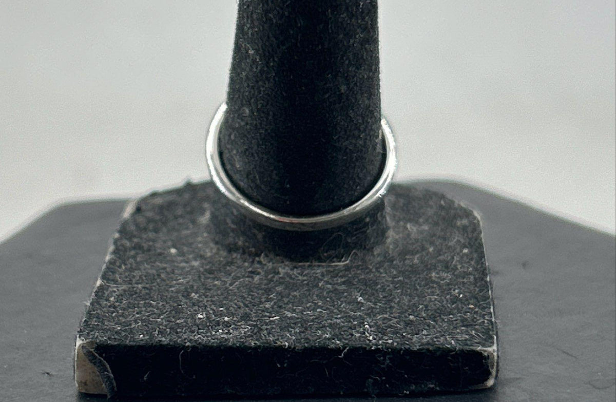 Silver cocktail ring with pear-shaped iridescent stone in prong setting, view 5
