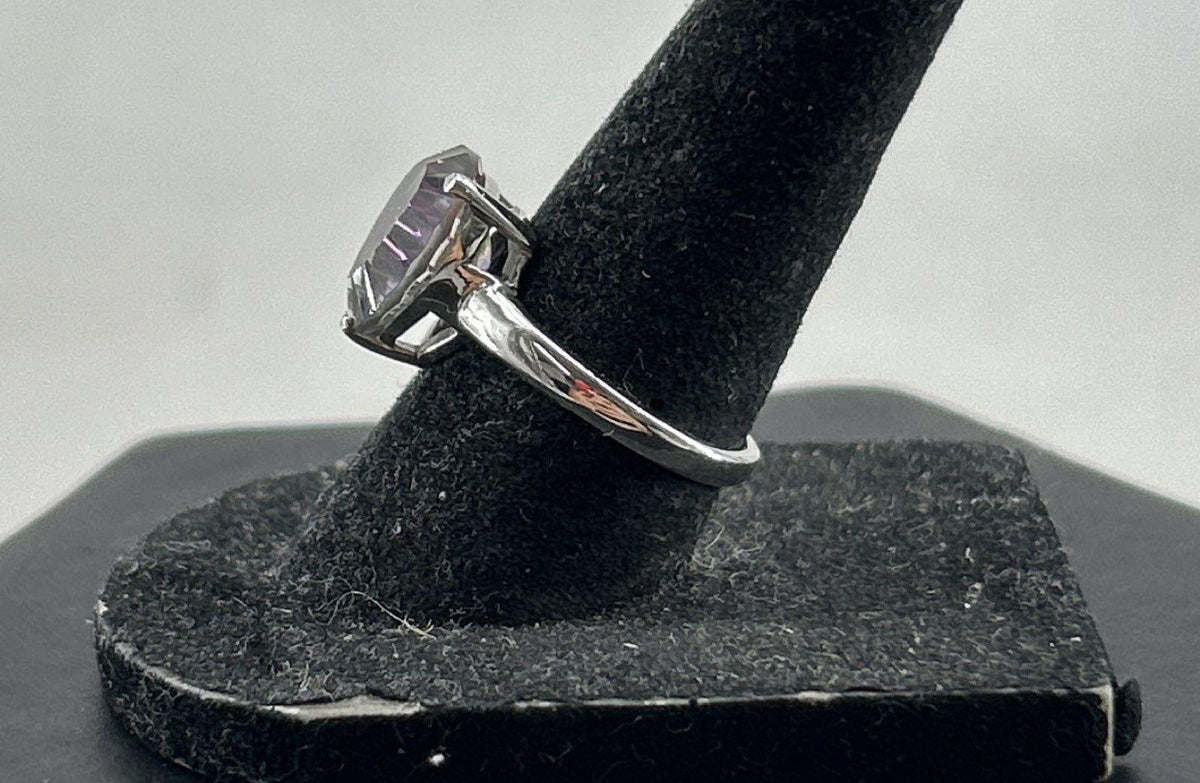 Silver cocktail ring with pear-shaped iridescent stone in prong setting, view 6