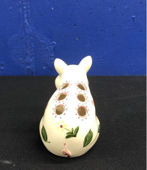 Fitz and Floyd white figural pig toothpick holder painted with pink blossoms and green stems, view 5