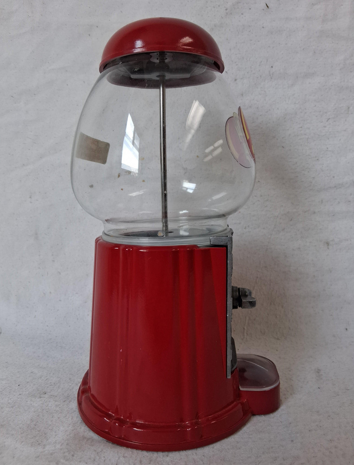 Jelly Belly candy dispenser with clear globe, red body and embossed silver-tone faceplate, view 6