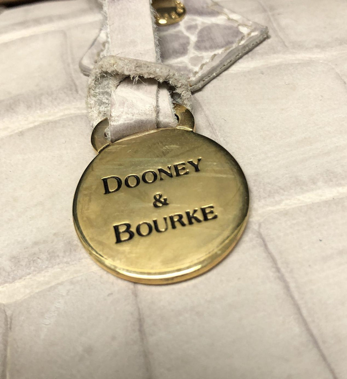 Dooney and Bourke white croc-embossed satchel with gold-tone turn-lock and logo medallion, view 7