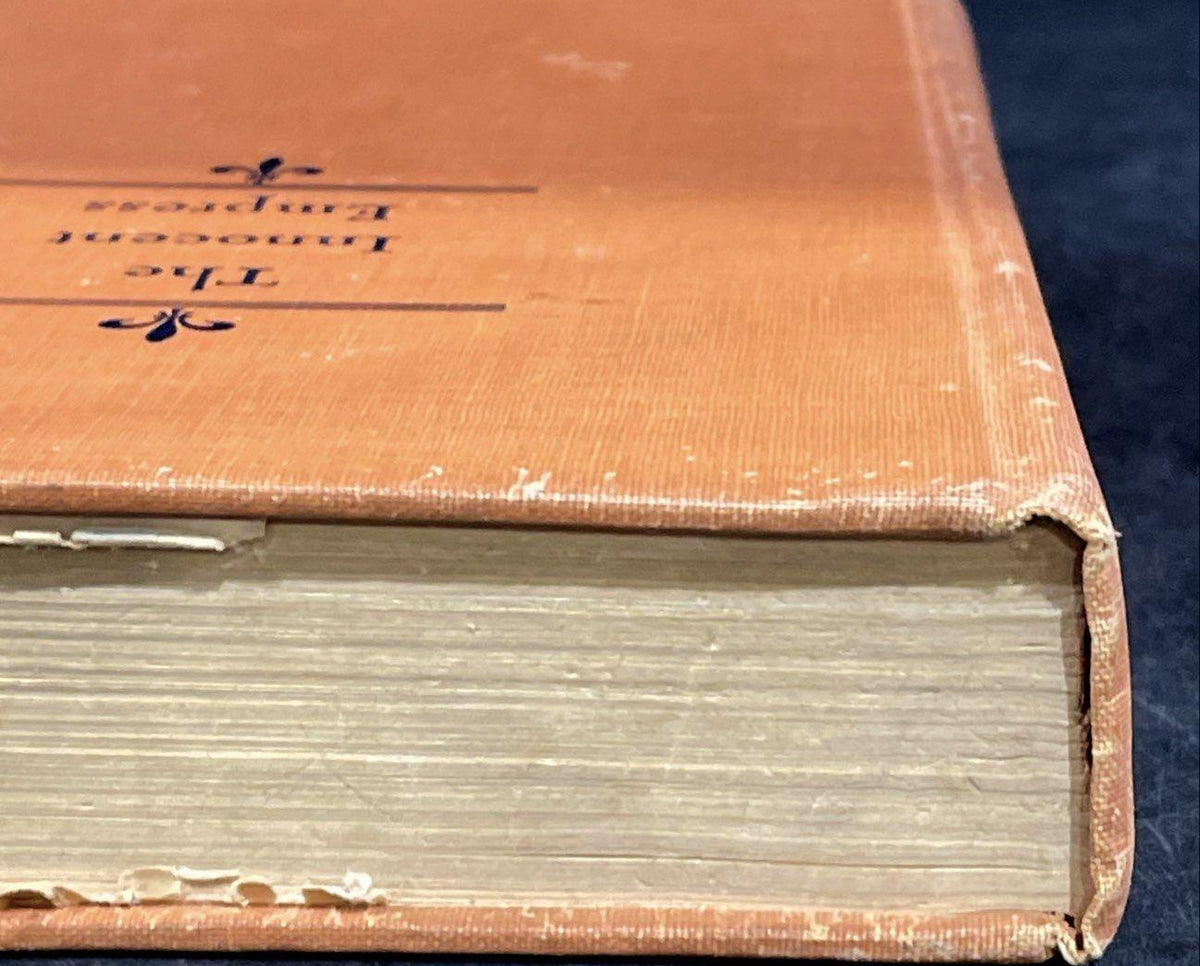 The Innocent Empress by Erna Barschak, orange-tan cloth hardcover with fleur-de-lis stamping, view 6