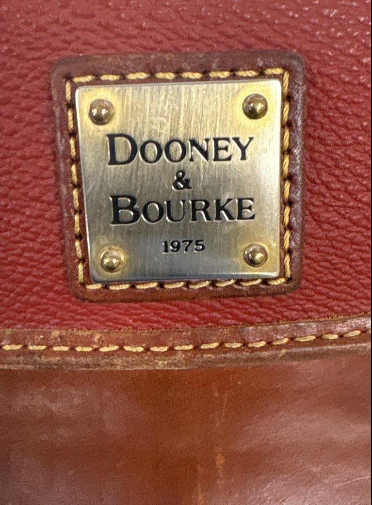 Dooney and Bourke red-brown pebbled envelope wallet with gold-tone 1975 plaque, view 6