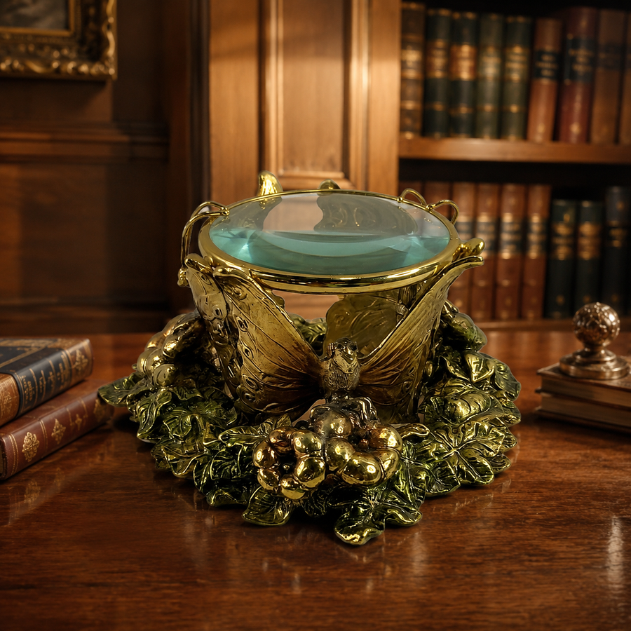 Gold-tone desk magnifying glass framed with butterflies, flowers and colored stone accents