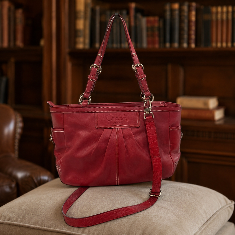 Coach chili red pebbled leather convertible tote with silver-tone buckle handles and ruched center panel