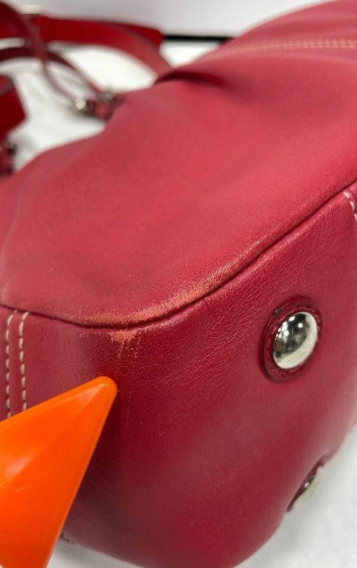 Coach chili red pebbled leather convertible tote with silver-tone buckle handles and ruched center panel, view 9
