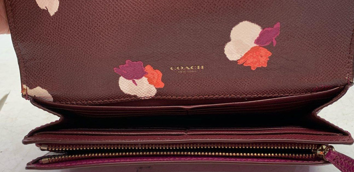 Coach burgundy leather snap flap wallet with gold-tone hardware and floral print interior, view 4