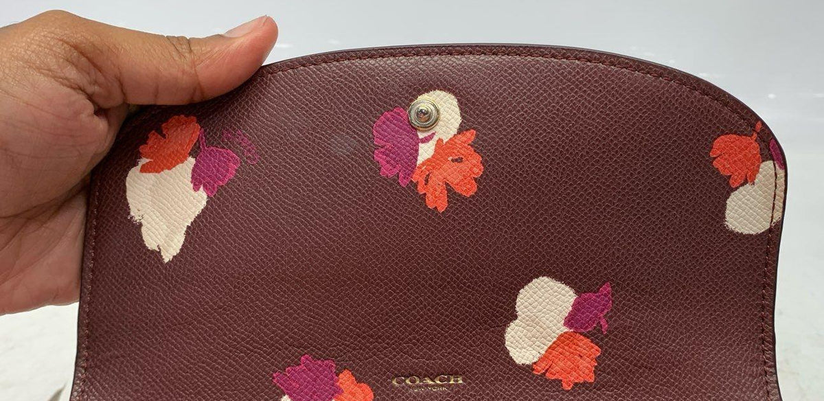 Coach burgundy leather snap flap wallet with gold-tone hardware and floral print interior, view 5