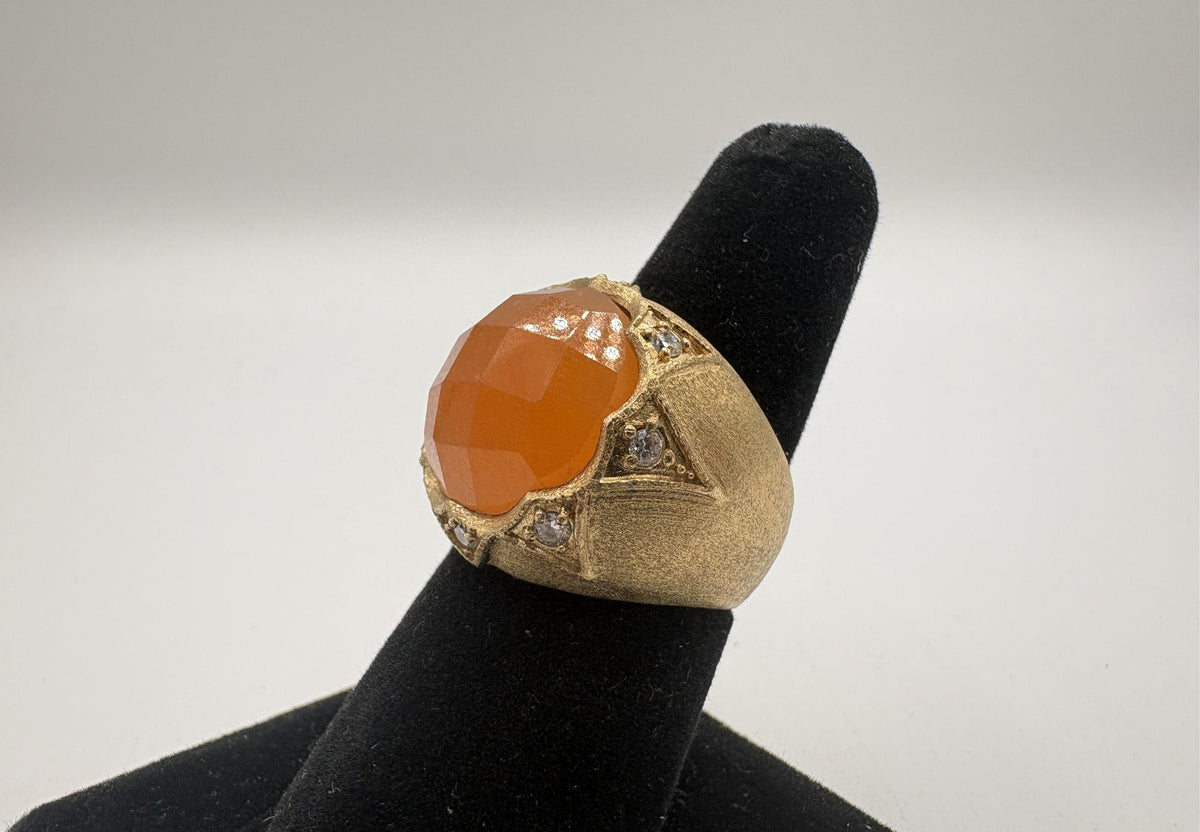 Gold-tone ornate statement ring with faceted amber-orange center stone, view 3