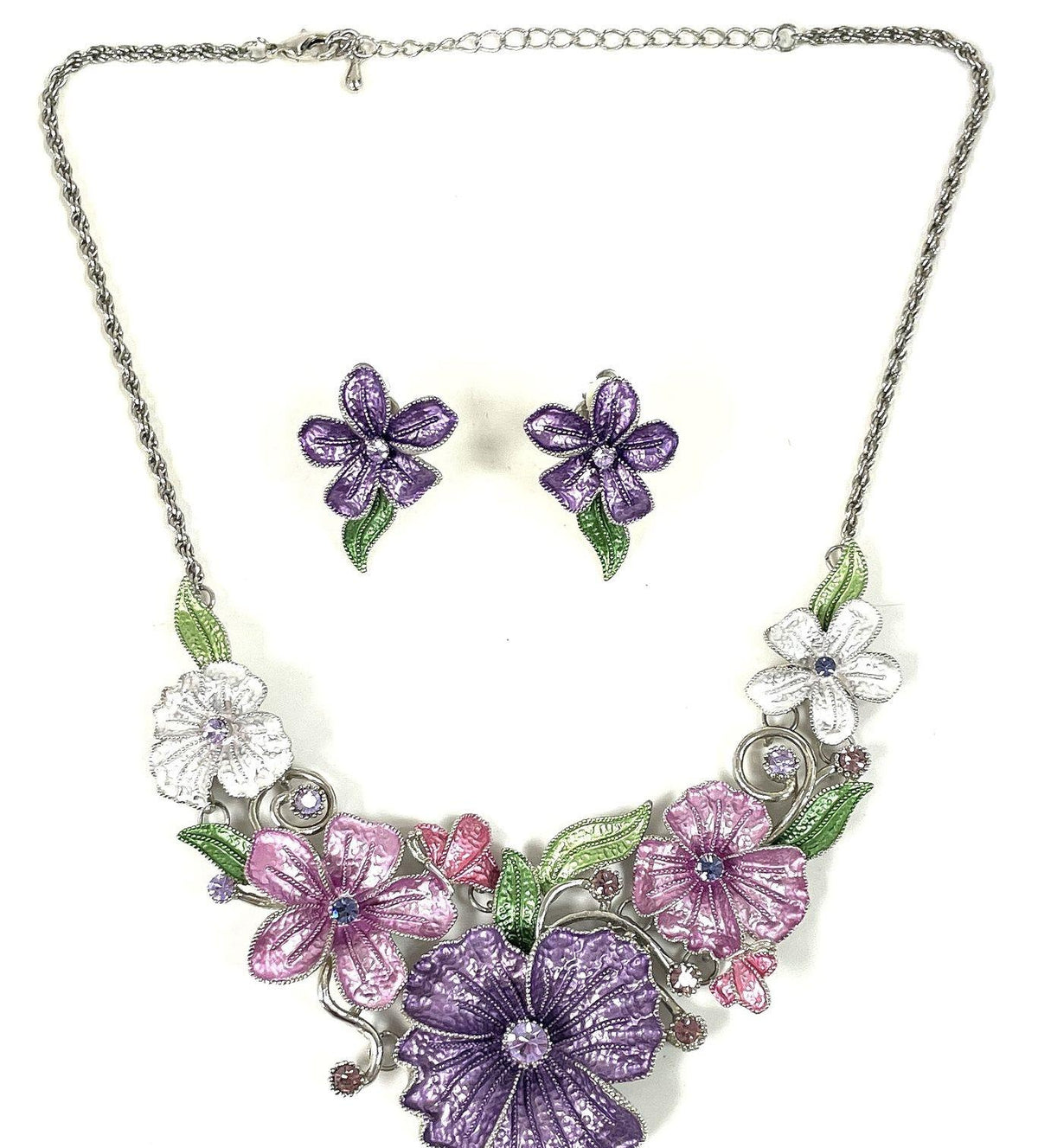 Silver-tone floral bib necklace and clip-on earrings with pink, purple and white flowers and green leaves, view 2