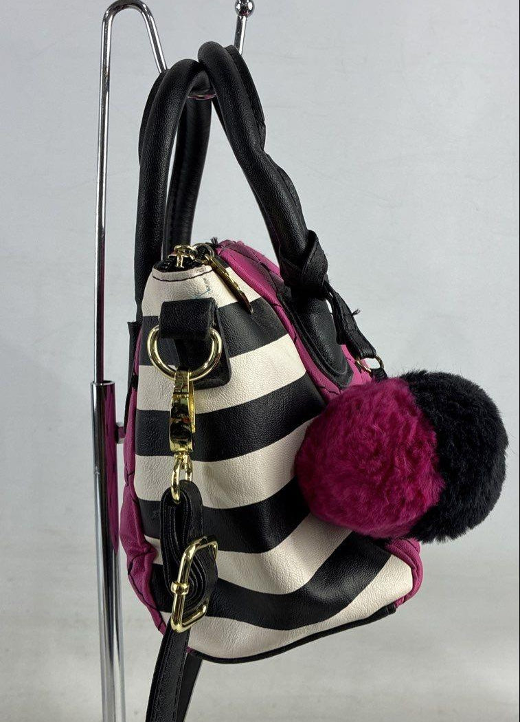 Betsey Johnson magenta quilted heart stitch crossbody bag with striped side panels and pom pom charm, view 4