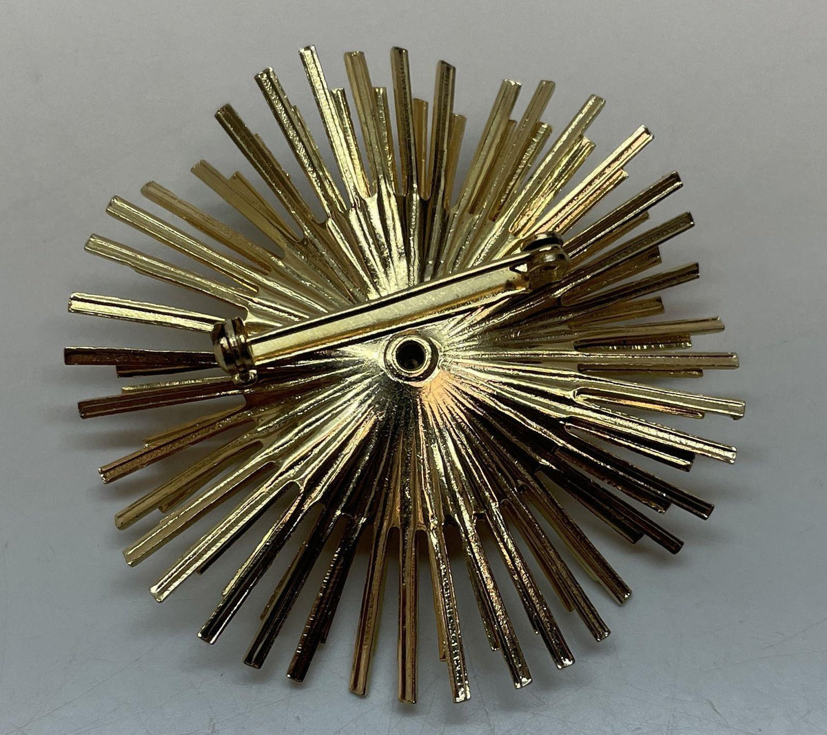 Gold-tone layered sunburst brooch with faux pearl center, view 4