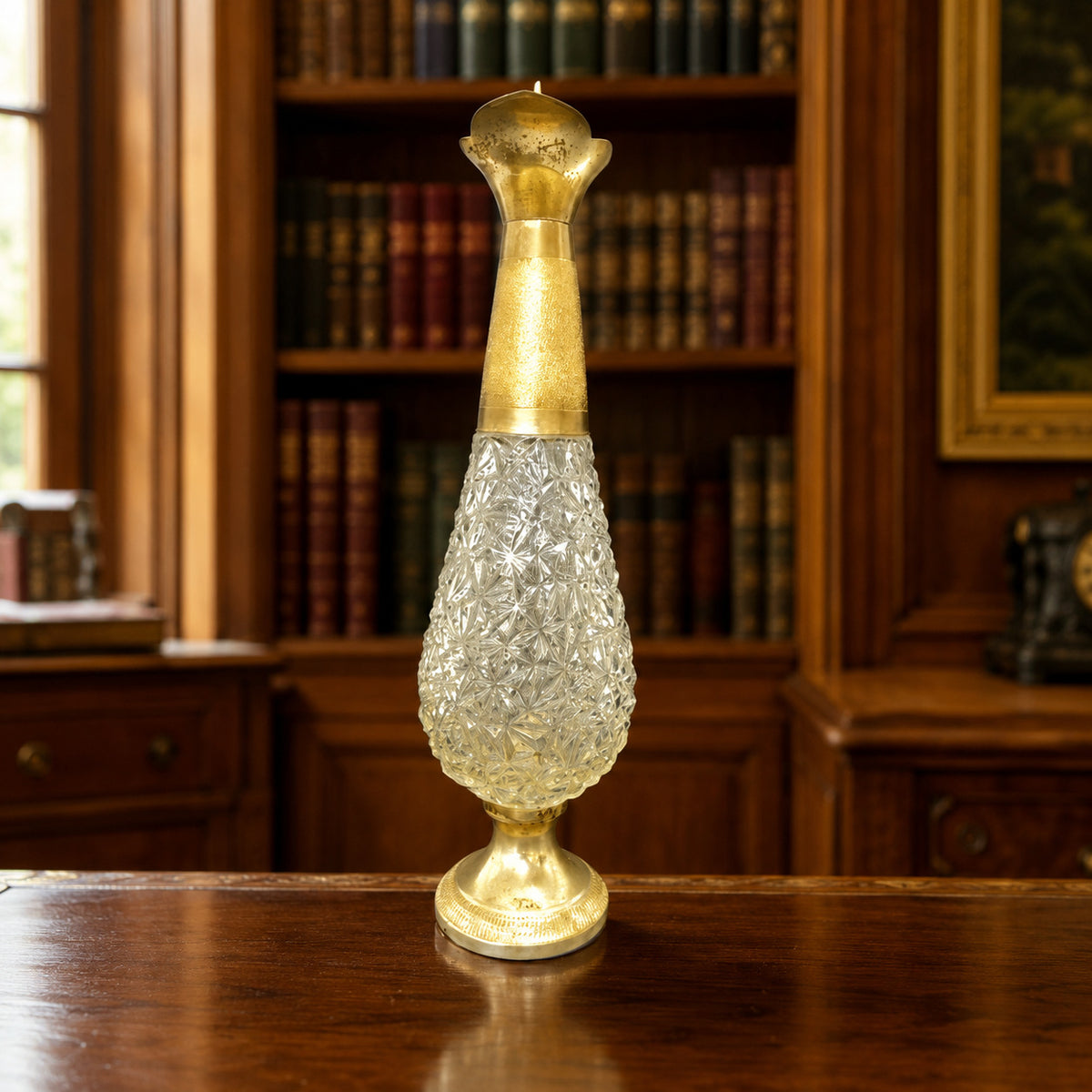 Tall cut glass ewer with diamond pattern and ornate gold-tone metal base, neck and handle