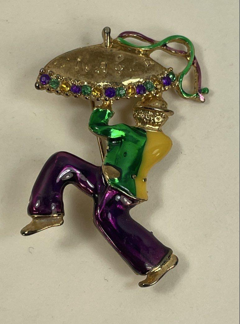 Gold-tone enamel brooch of a jester holding a jeweled parasol, view 2