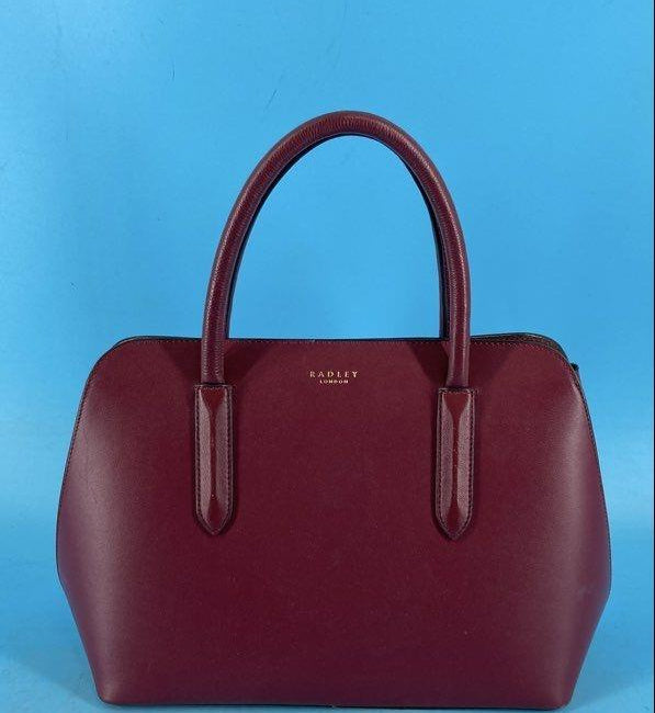 Radley London burgundy leather structured satchel with rolled top handles and patent handle tabs, view 2