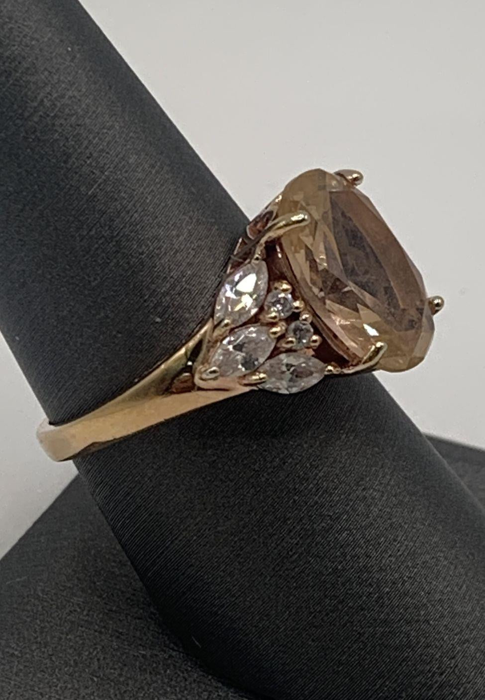 Signed BBJ gold-tone cocktail ring with oval champagne center stone and clear cluster, view 4