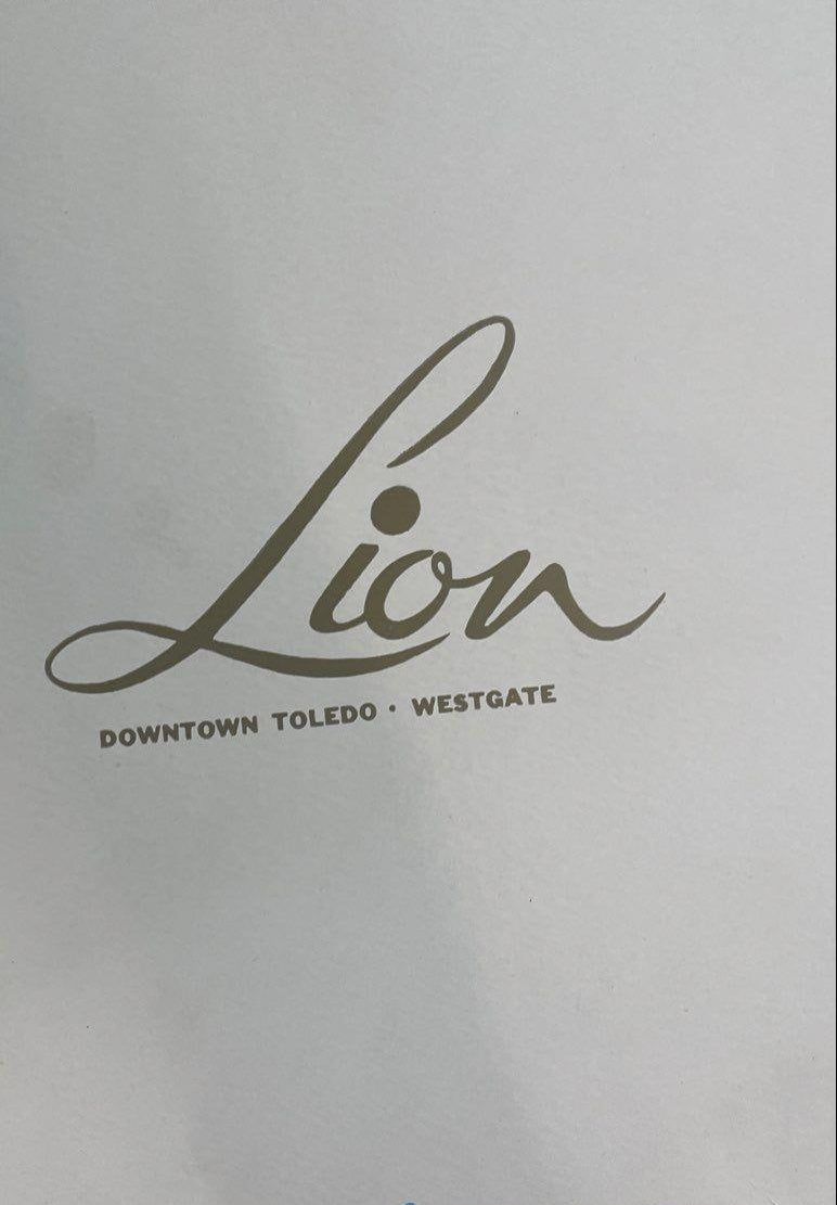 White plush bucket hat with black lining in hexagonal Lion Store Toledo hatbox, view 3