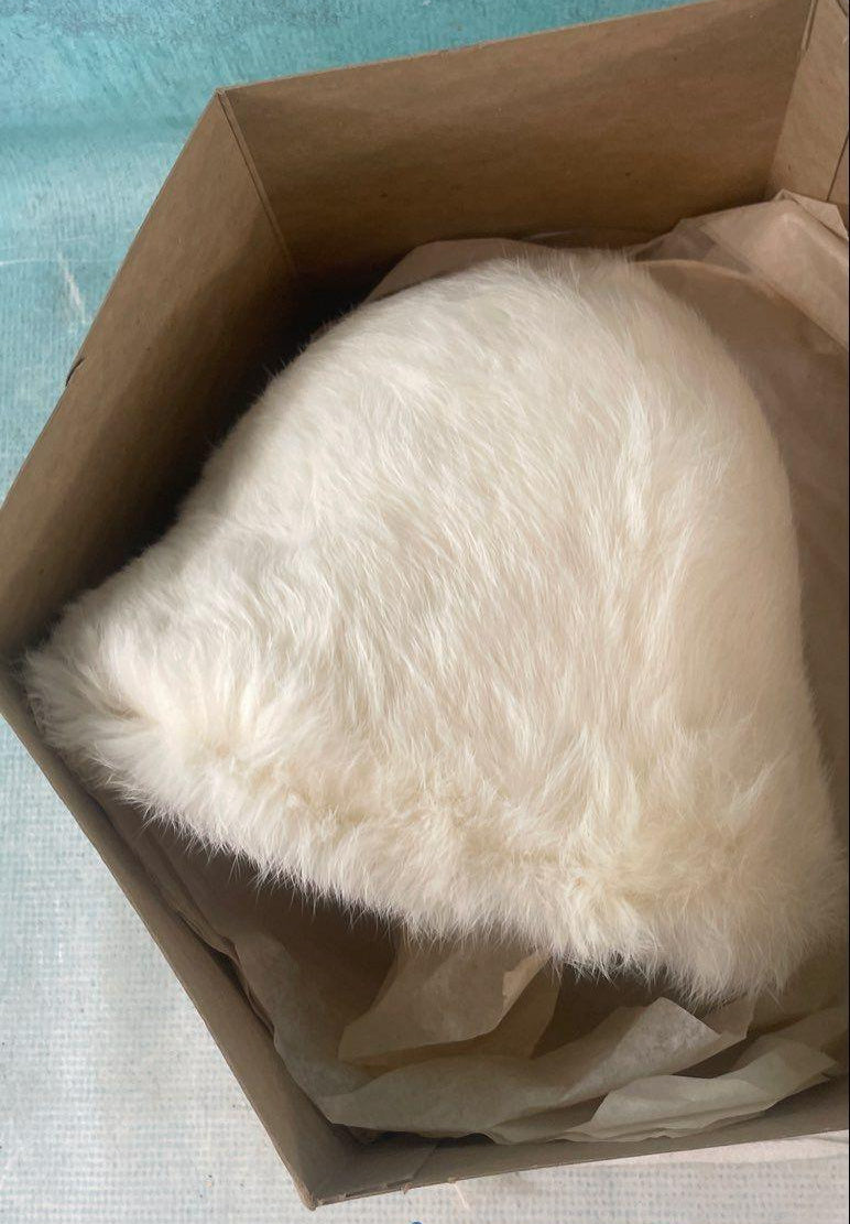 White plush bucket hat with black lining in hexagonal Lion Store Toledo hatbox, view 5