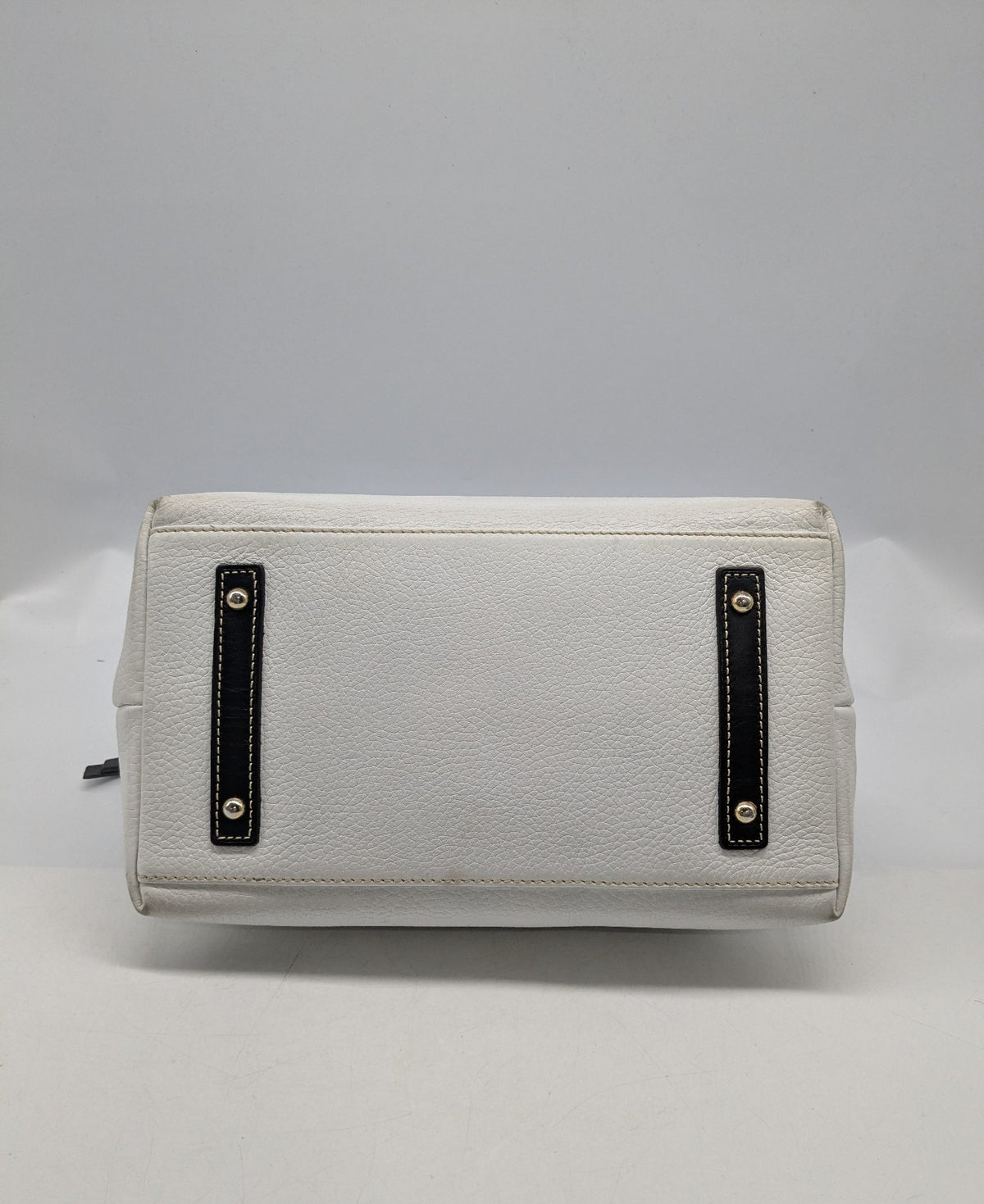 Dooney and Bourke white pebbled leather satchel with black trim and gold-tone hardware, view 6