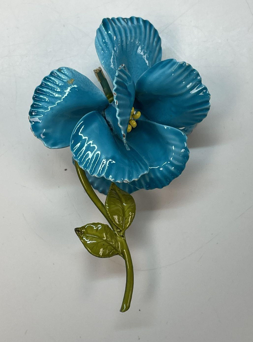 Dimensional flower brooch with ruffled turquoise-blue enamel petals and olive-green leaves, view 2