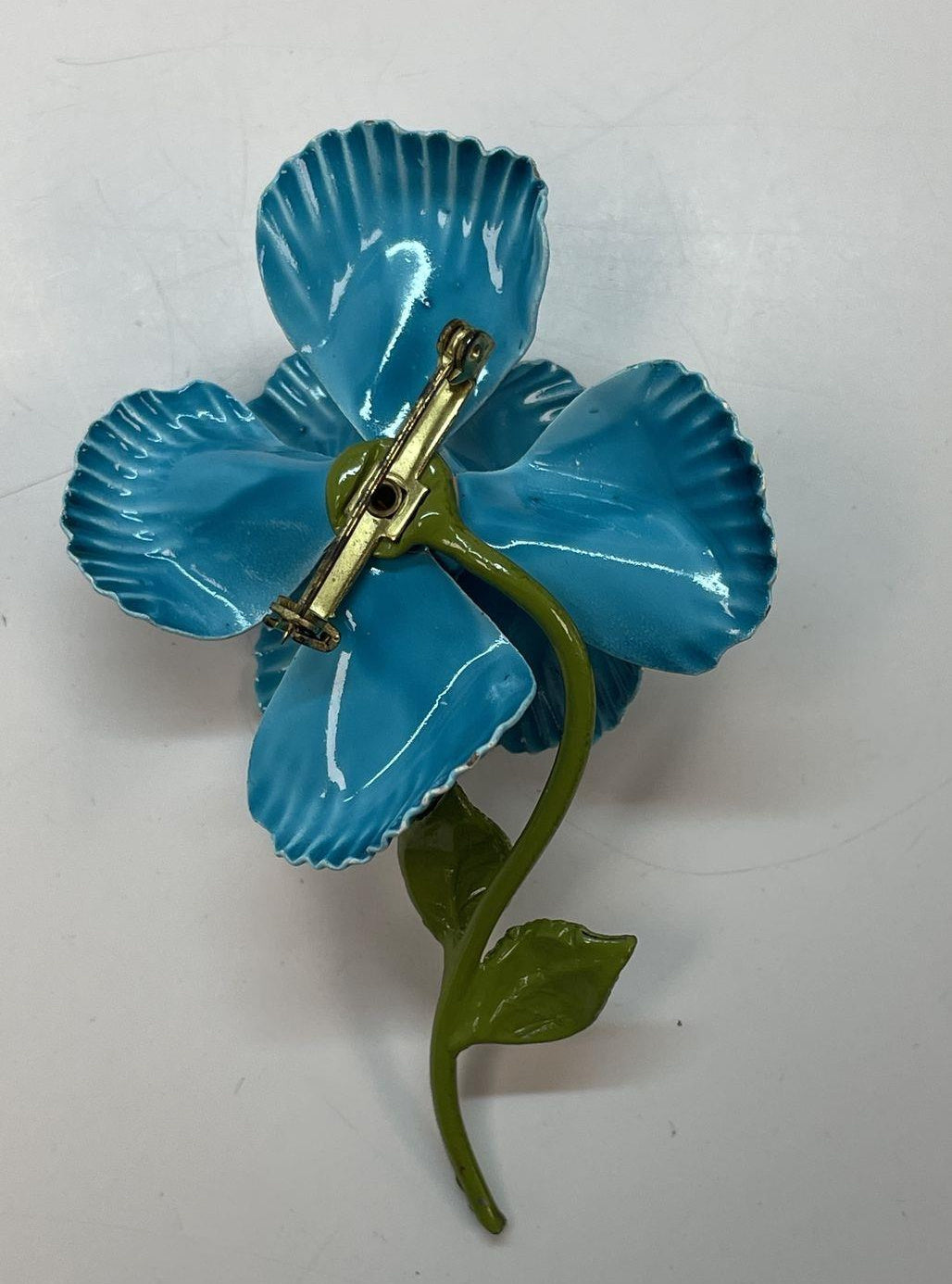 Dimensional flower brooch with ruffled turquoise-blue enamel petals and olive-green leaves, view 4