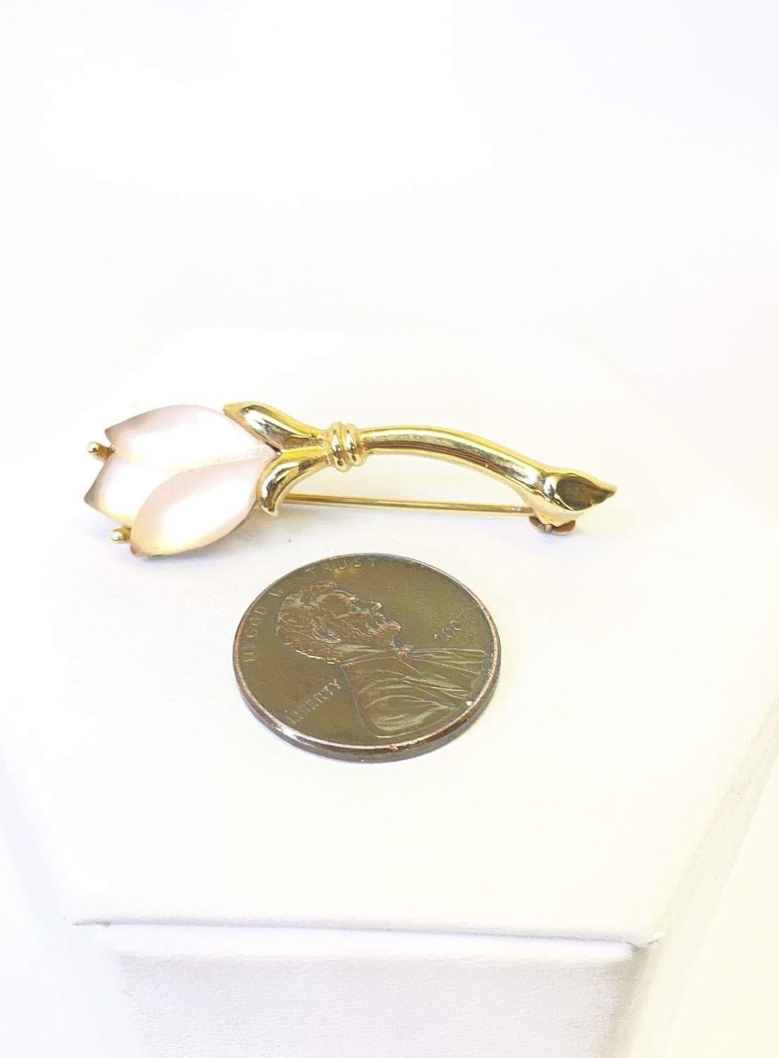 Petite gold-tone flower brooch with two frosted pale pink petals and slender leaf, view 3
