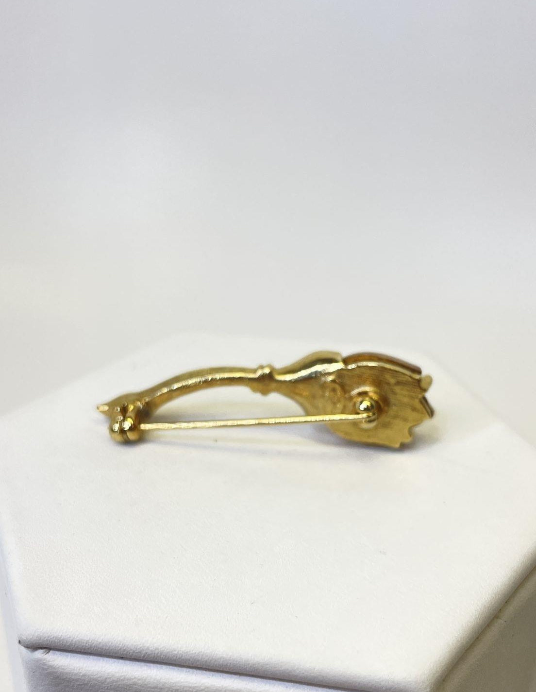 Petite gold-tone flower brooch with two frosted pale pink petals and slender leaf, view 4