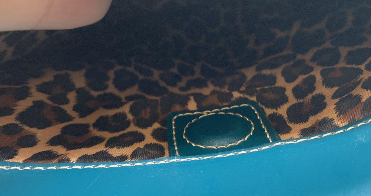 Teal leather tote with white contrast stitching, silver-tone hardware and leopard print lining, view 5