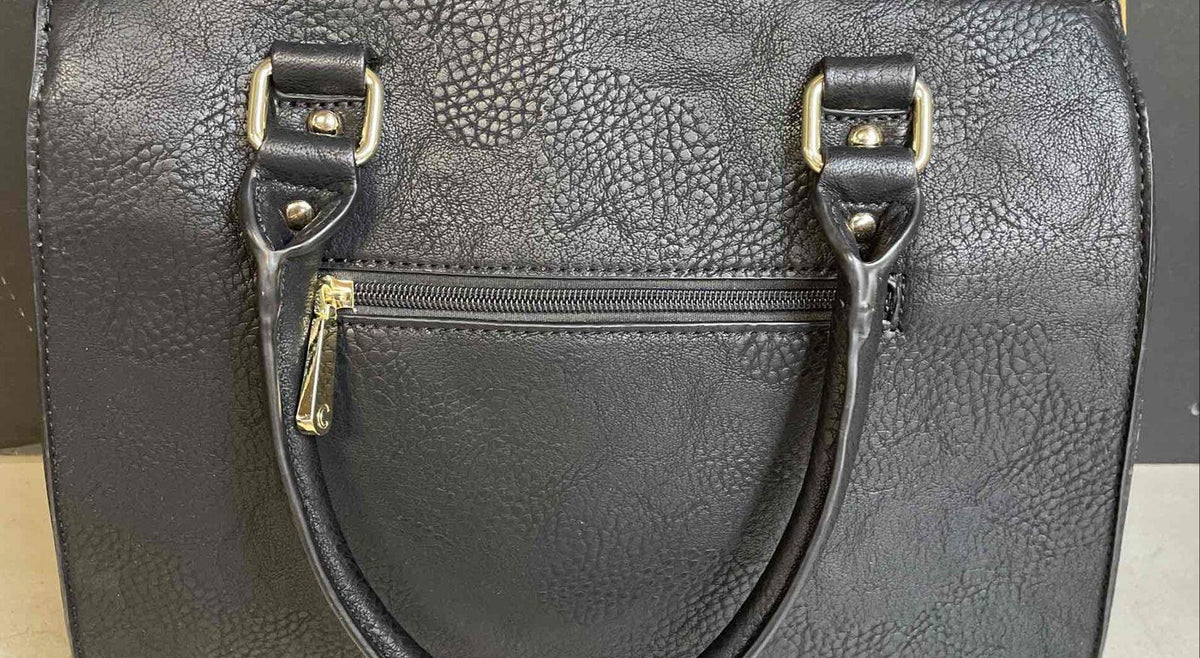 Black and white color block faux leather satchel with gold-tone lock charm and crossbody strap, view 3