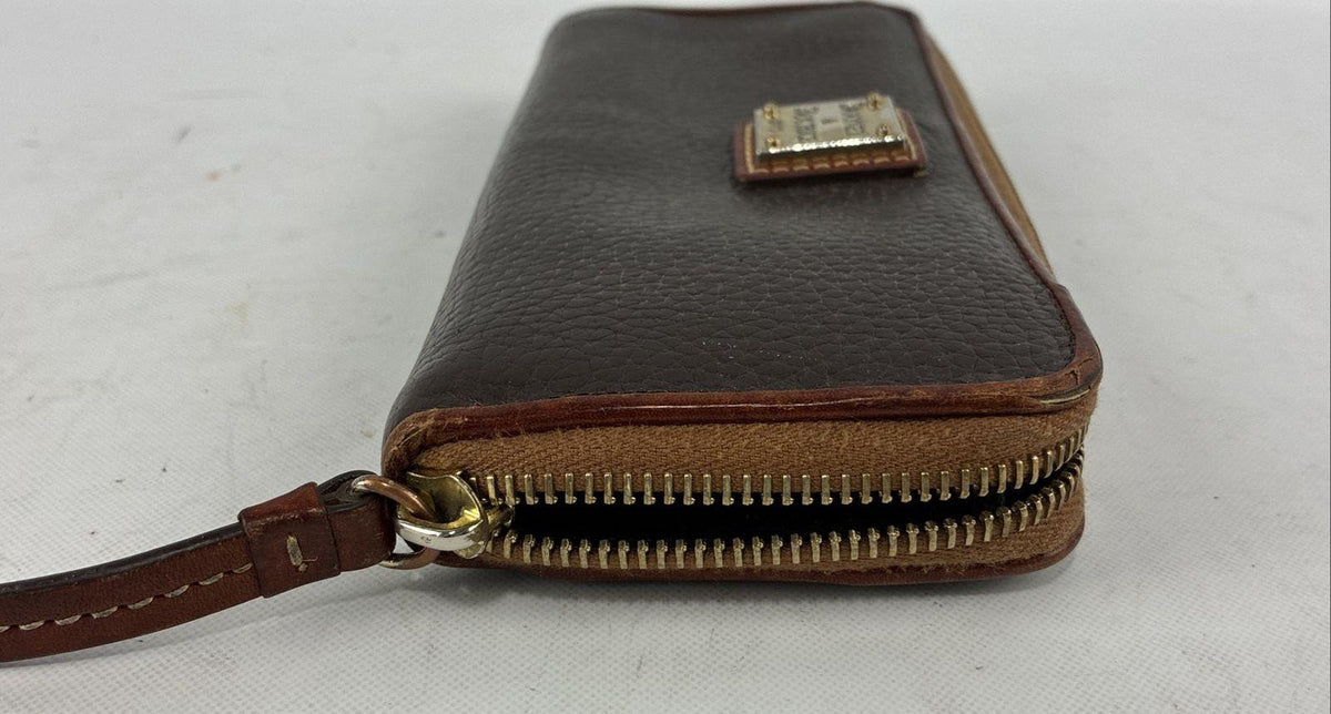 Dooney & Bourke brown pebbled leather zip around wallet with tan trim and red interior, view 6