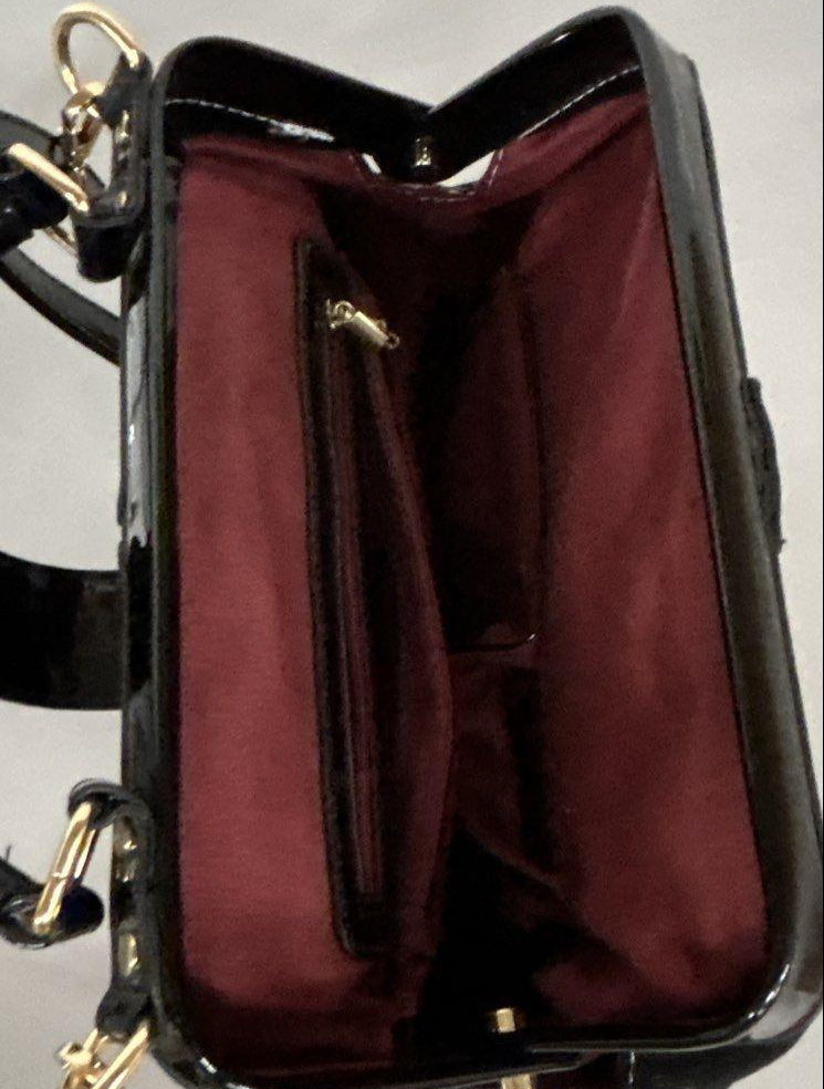 Red, black and white patent-look colorblock frame satchel with circle motifs and top handle, view 5