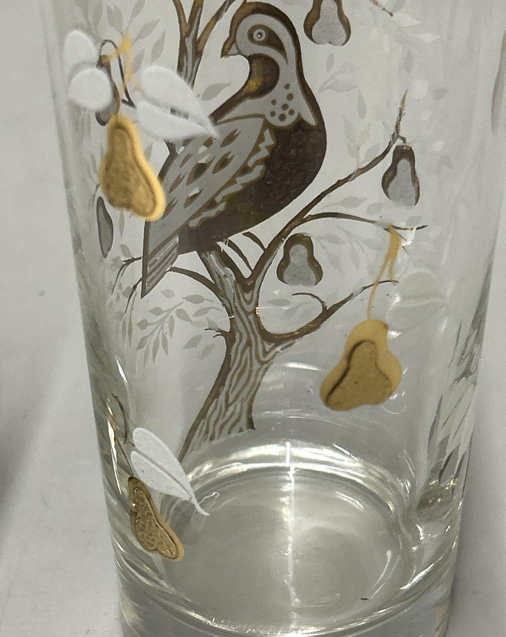 Two clear glass highball tumblers with gold-tone partridge and pear tree design and white foliage, view 4