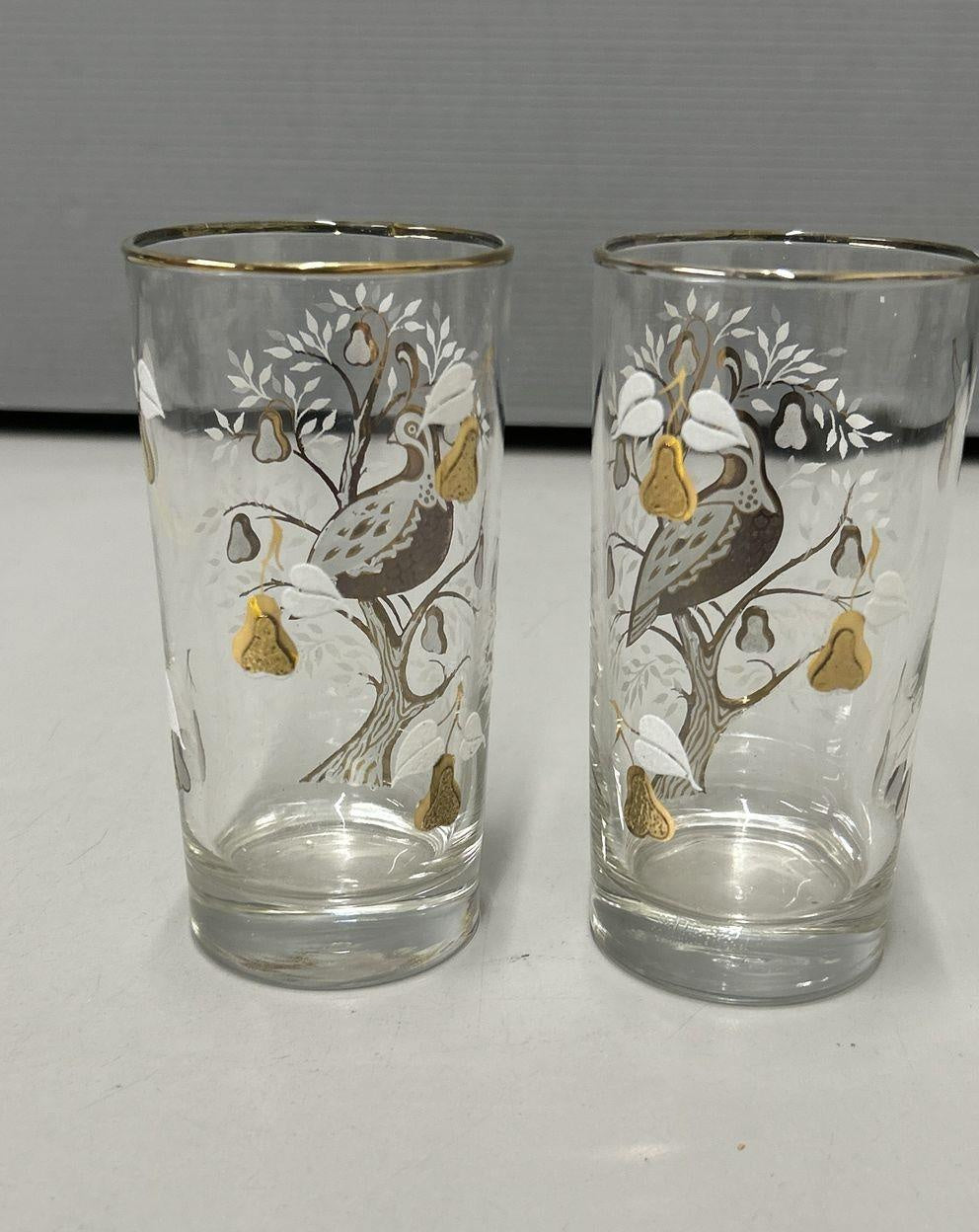 Two clear glass highball tumblers with gold-tone partridge and pear tree design and white foliage, view 5