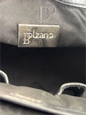 Black leather handbag with silver-tone hardware and turn-lock front pocket, view 8