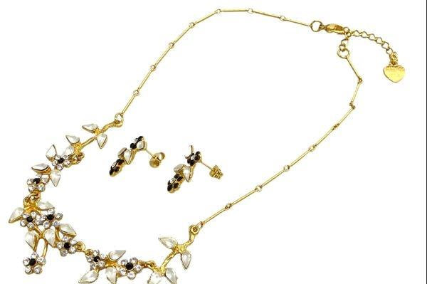 Gold-tone Yoni Z necklace and post earrings with black and white flowers and clear accents, view 4