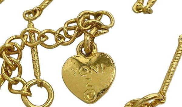 Gold-tone Yoni Z necklace and post earrings with black and white flowers and clear accents, view 7