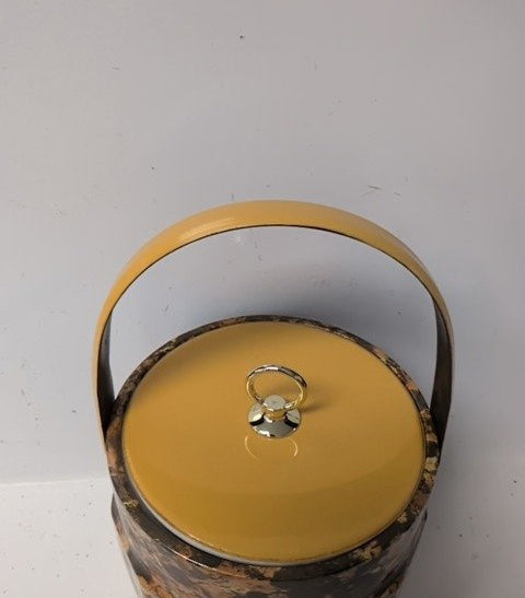 Tortoiseshell-style marbled ice bucket with mustard-yellow lid, gold-tone ring pull and chrome-tone handle, view 3