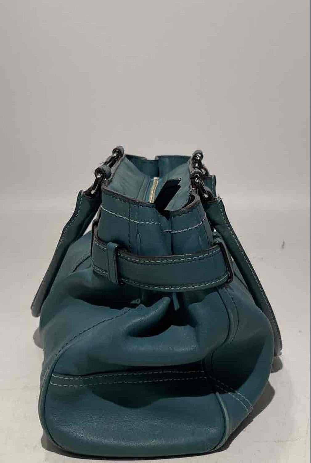 Coach teal leather shoulder bag with silver-tone rings, belted front strap and tasseled ties, view 6