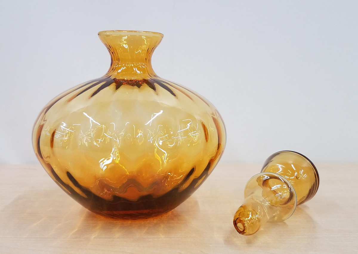 Amber glass decanter with optic ribbed rounded body and faceted stopper, view 4