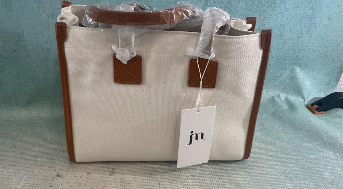 Jessica Moore cream canvas satchel with tan trim, front cargo pocket and gray dust bag, view 8