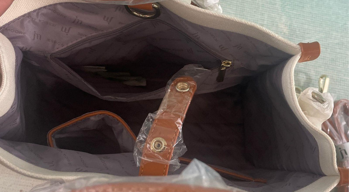 Jessica Moore cream canvas satchel with tan trim, front cargo pocket and gray dust bag, view 10